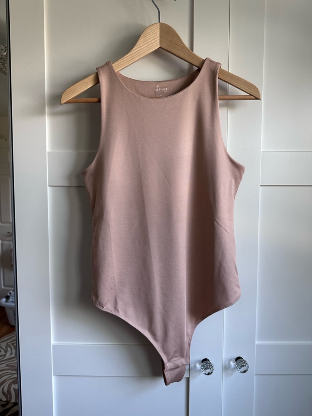 NWT Sleeveless Blush Bodysuit